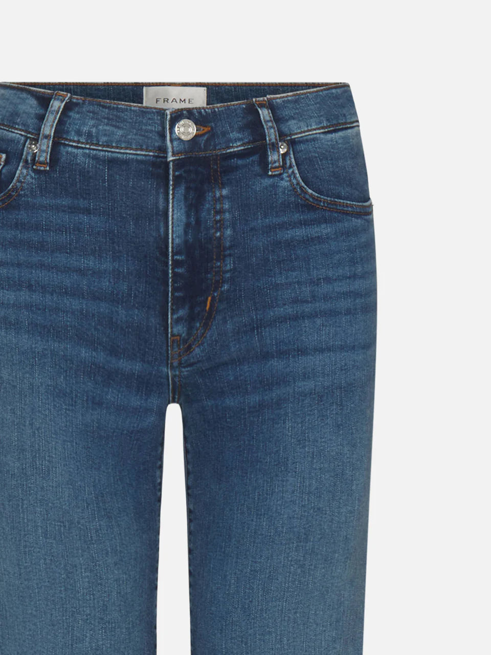 Medium wash straight leg denim jeans with classic five-pocket styling and branded button closure — Frame | Endless UAE