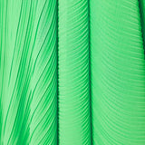 Bright green pleated asymmetric maxi dress with white belt and puff sleeves — Solace London | Endless UAE