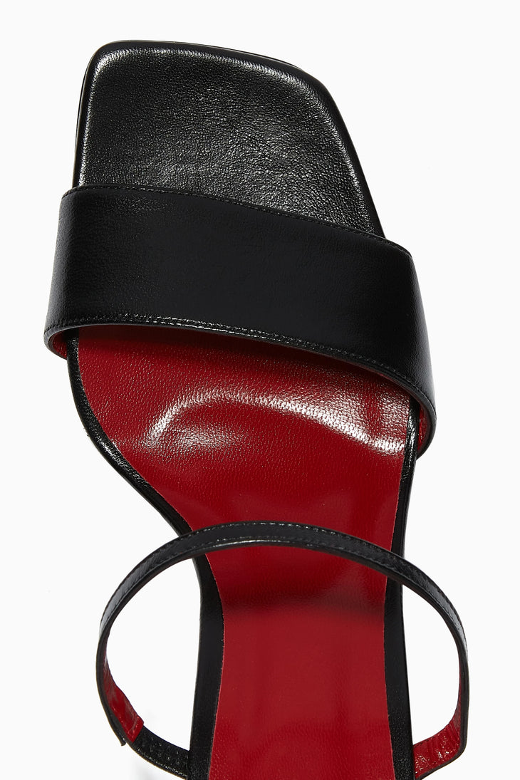Black leather mules with red insole and dual thin ankle straps, featuring square toe design and block heel — By Far | Endless UAE