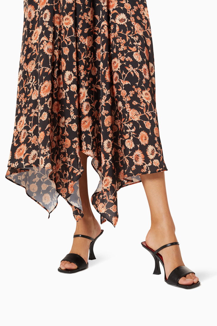 Black leather mule sandals with sculptural flared heel and single toe strap — By Far | Endless UAE