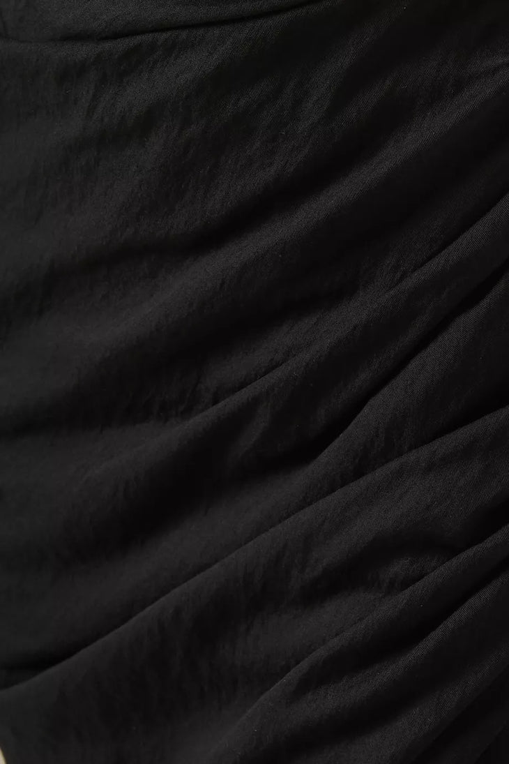 Black draped fabric with flowing folds and luxurious texture — Jacquemus | Endless UAE