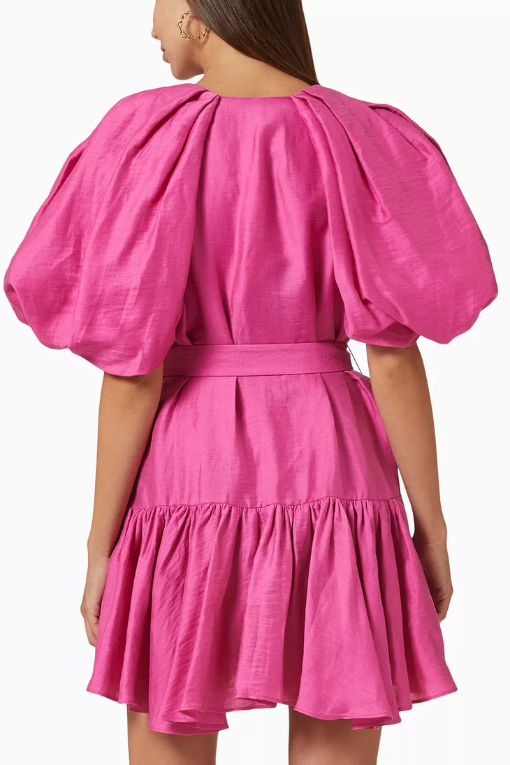 Woman wearing bright pink puff-sleeve mini dress with belt and ruffled hem — Acler | Endless UAE