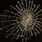 Black maxi dress with gold sunburst embellishment and flowing bell sleeves — RIXO | Endless UAE