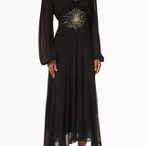 Black maxi dress with gold sunburst embellishment and flowing bell sleeves — RIXO | Endless UAE