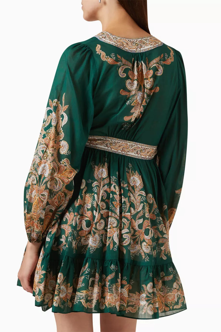 Emerald green mini dress with ornate paisley embroidery, long sleeves, wrap waist belt, and tiered ruffle hem — Zimmermann | Endless UAE