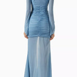 Woman wearing petrol blue long-sleeve maxi dress with ruched detailing and front slit — De La Vali | Endless UAE
