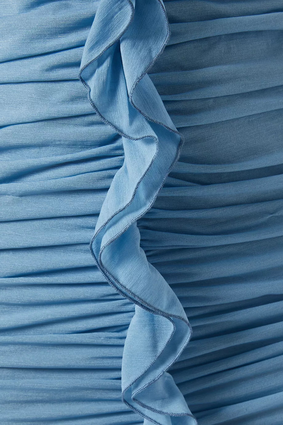 Woman wearing petrol blue long-sleeve maxi dress with ruched detailing and front slit — De La Vali | Endless UAE