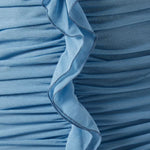 Woman wearing petrol blue long-sleeve maxi dress with ruched detailing and front slit — De La Vali | Endless UAE