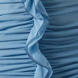 Woman wearing petrol blue long-sleeve maxi dress with ruched detailing and front slit — De La Vali | Endless UAE