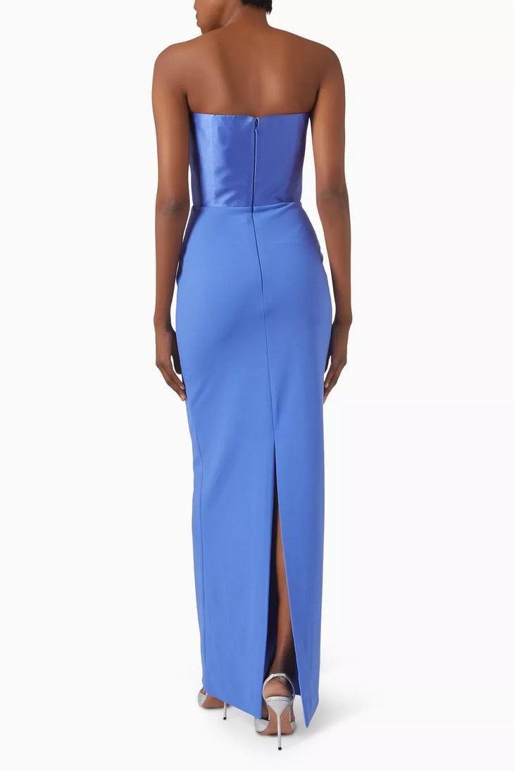 Blue strapless maxi dress with back slit and zipper closure, rear view on model — Solace London | Endless UAE
