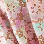 Pastel floral lace fabric with scalloped edges in pink, mint and cream tones — Elliatt | Endless UAE