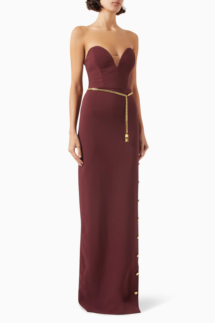 Strapless burgundy maxi dress with gold chain belt and button details — Elisabetta Franchi | Endless UAE