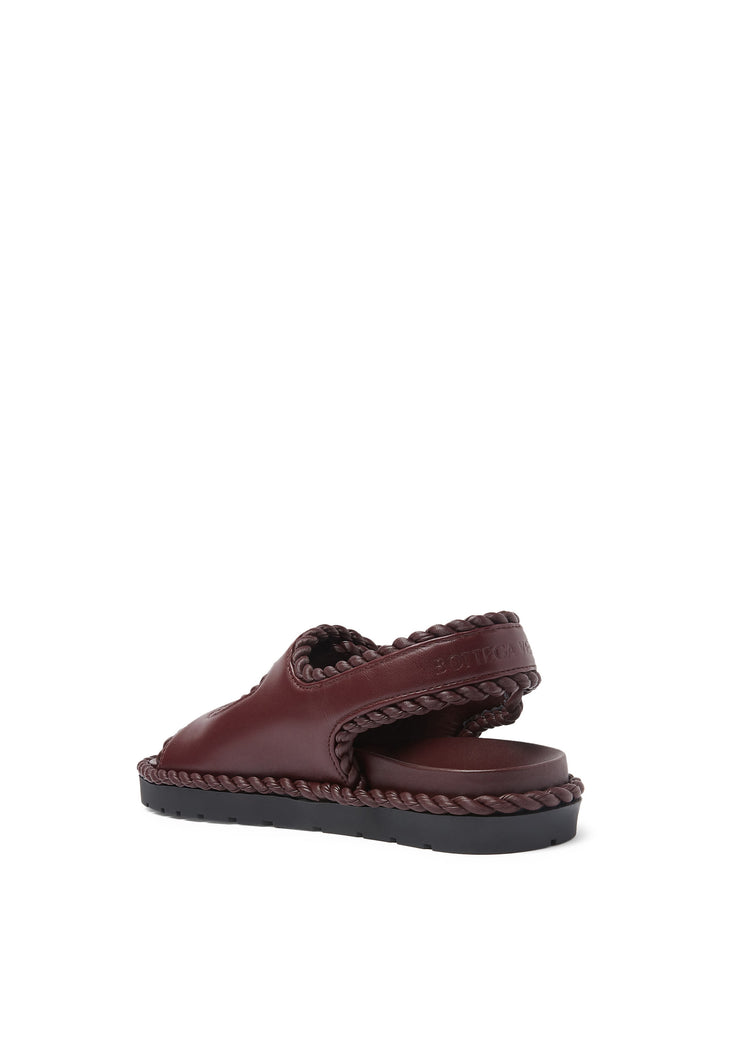 Deep burgundy leather sandals with braided trim detail and ankle strap — Bottega Veneta | Endless UAE