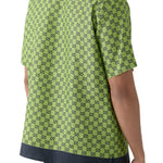 Back view of lime green silk shirt with black GG monogram print and contrasting dark collar and hem — Gucci | Endless UAE