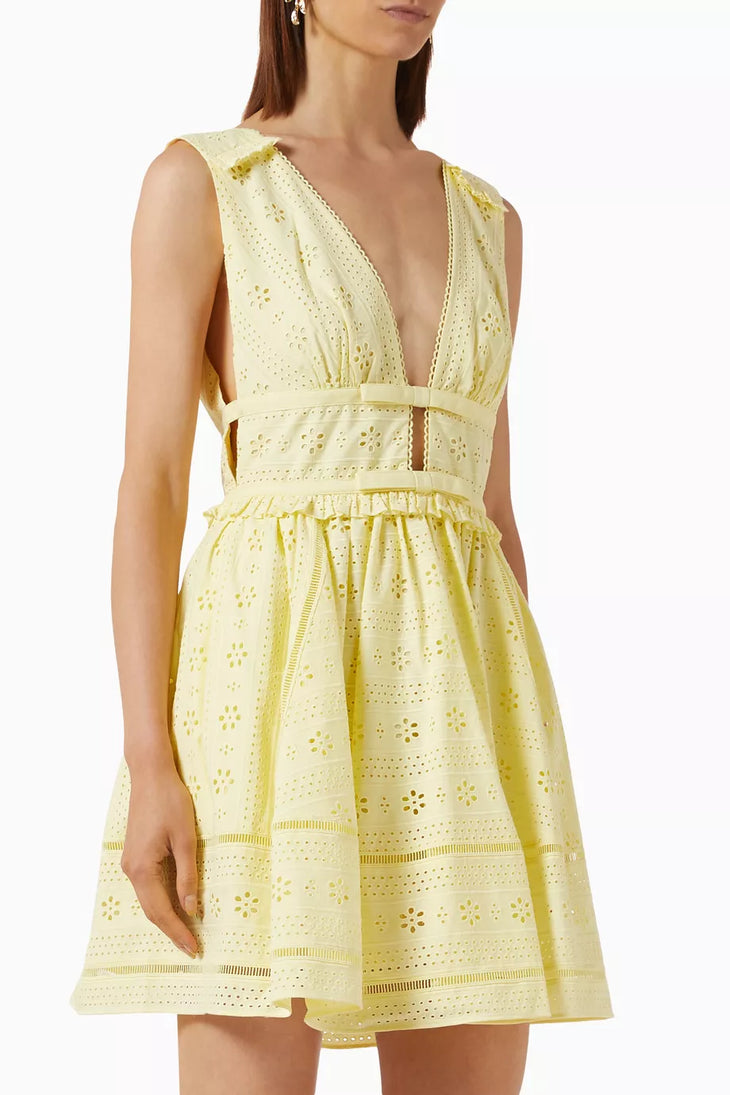 Pale yellow broderie anglaise mini dress with deep V-neckline and waist cutouts — Self-Portrait | Endless UAE