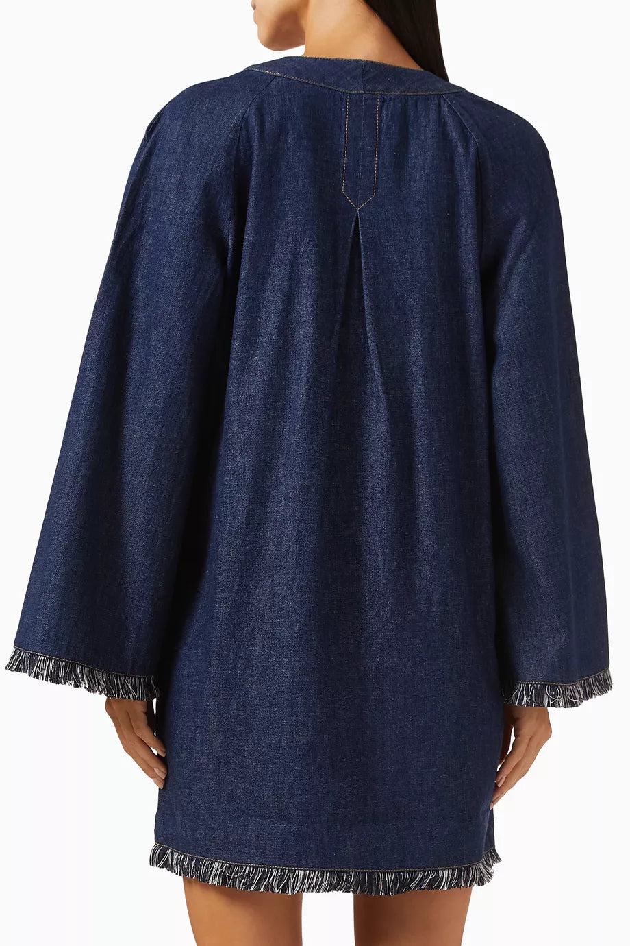 Dark denim mini dress with long sleeves, fringe trim detail at cuffs and hem, relaxed fit silhouette, back view — Zimmermann | Endless UAE
