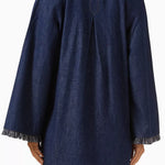 Dark denim mini dress with long sleeves, fringe trim detail at cuffs and hem, relaxed fit silhouette, back view — Zimmermann | Endless UAE