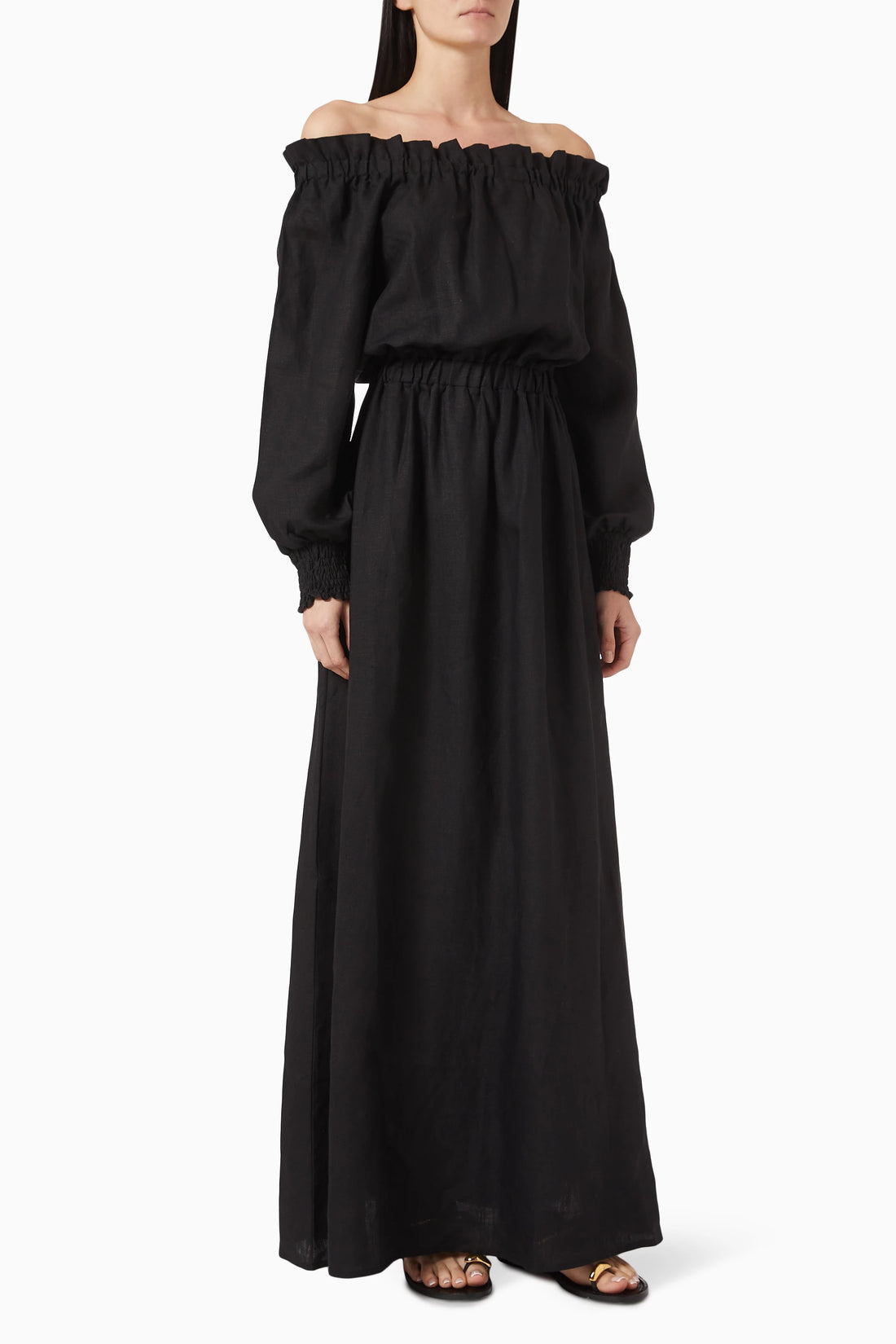 Black off-shoulder maxi dress with elasticated neckline, blouson sleeves, and gathered waist on model — Moeva | Endless UAE