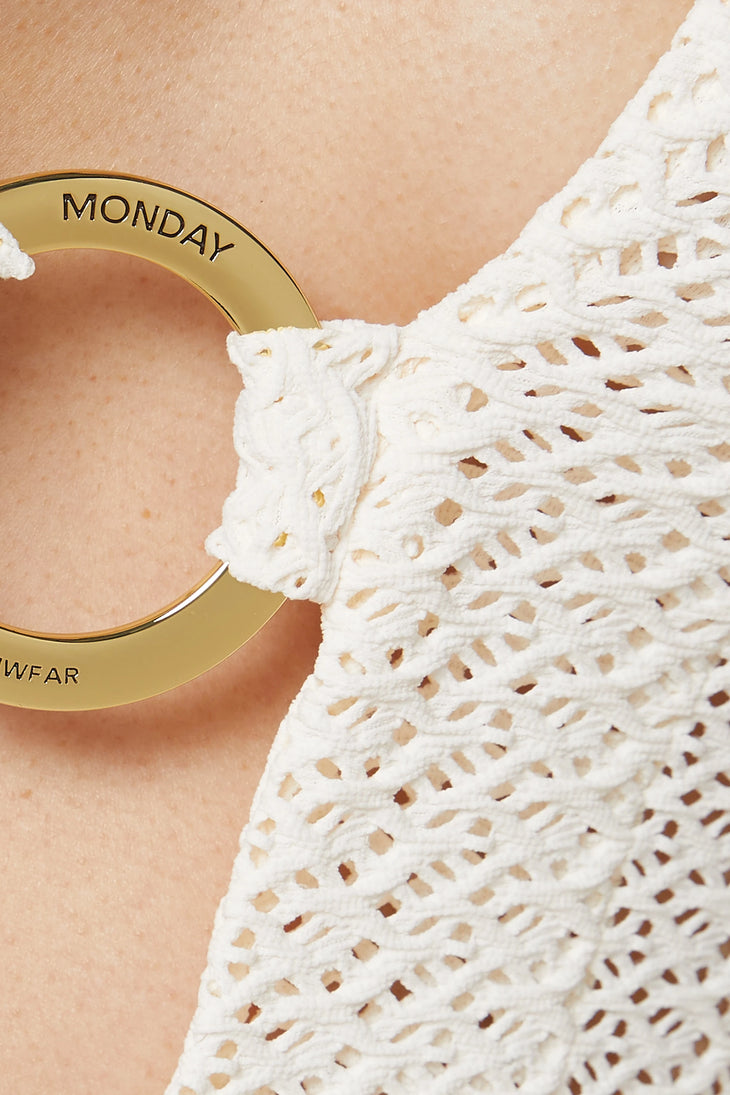White crochet mini dress with gold Monday branded ring detail on tan background — Monday Swimwear | Endless UAE