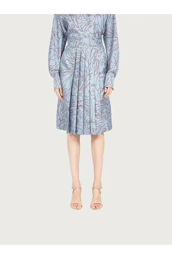 Ferragamo pleated silk skirt in blue with abstract marbled print, knee-length, worn with nude strappy heels — Ferragamo | Endless UAE