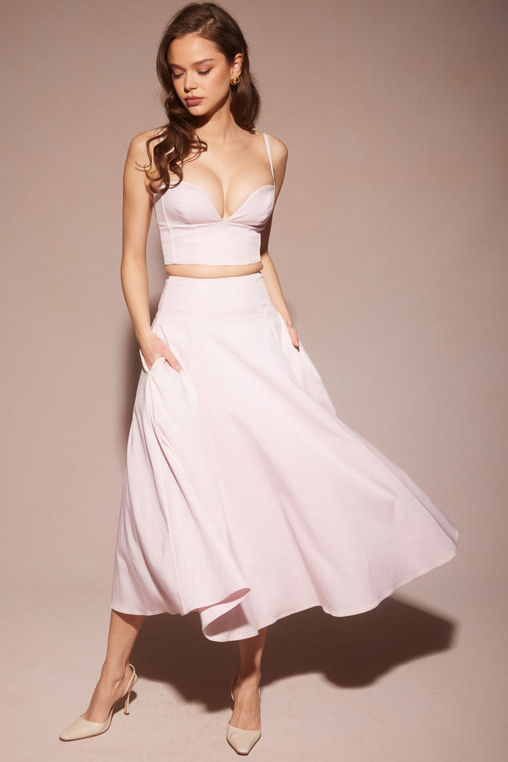 Elegant pale pink two-piece set with crop top and flowing midi skirt worn with nude heels — House of CB | Endless UAE