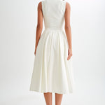 Woman wearing cream sleeveless midi dress with button front — Meshki | Endless UAE