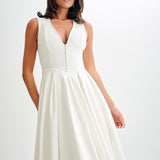 Woman wearing cream sleeveless midi dress with button front — Meshki | Endless UAE