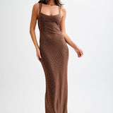 Jasmyn Hot Fix Maxi Dress With Mesh Back in bronze worn by woman against beach backdrop — Meshki | Endless UAE