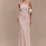 Woman wearing pale pink one-shoulder knit maxi dress, back view against neutral background — Meshki | Endless UAE