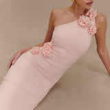 Woman wearing pale pink one-shoulder knit maxi dress, back view against neutral background — Meshki | Endless UAE