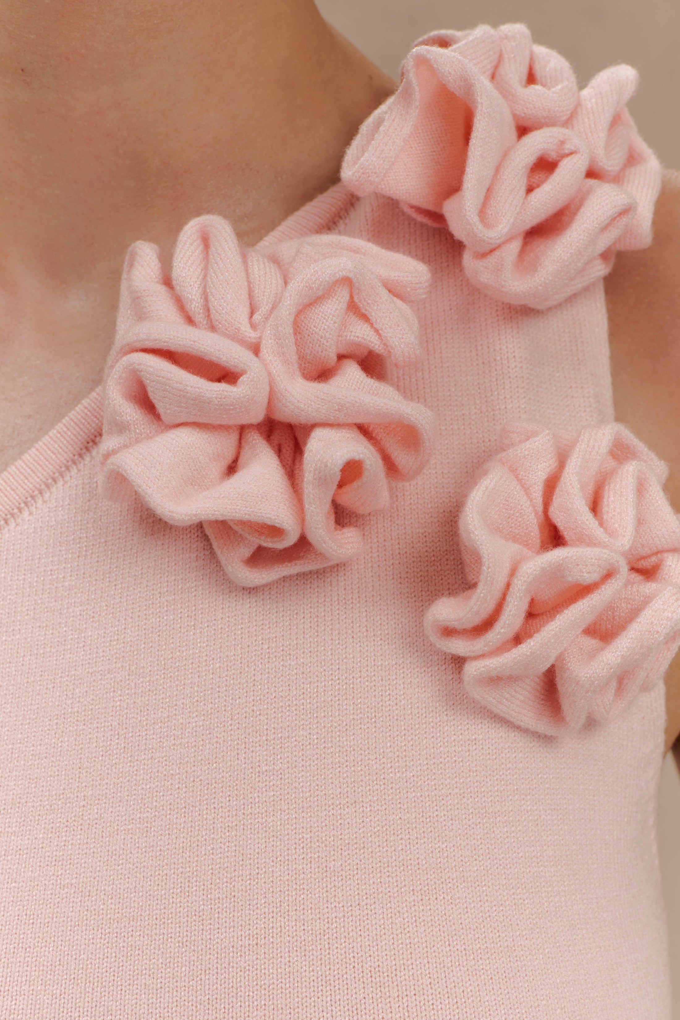 Woman wearing pale pink one-shoulder knit maxi dress, back view against neutral background — Meshki | Endless UAE