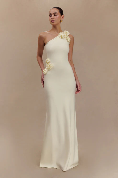 Woman modeling cream one-shoulder maxi dress with floral embellishment — Meshki | Endless UAE