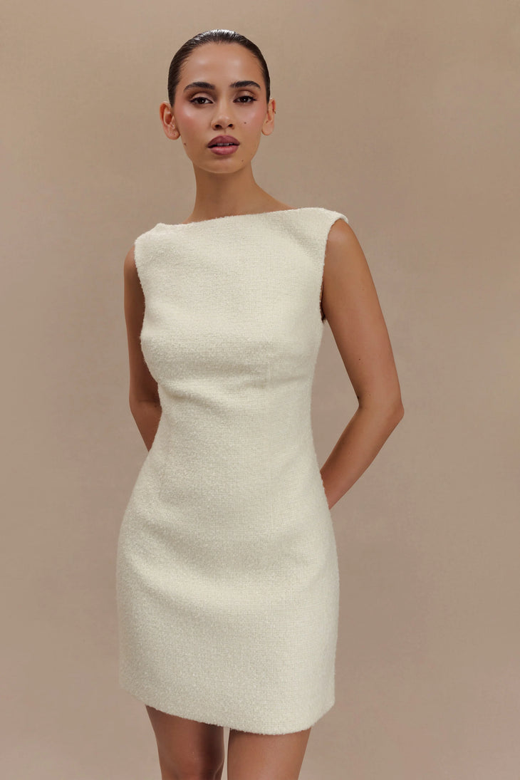 Woman wearing cream textured boucle sleeveless mini dress with white platform sandals — Meshki | Endless UAE