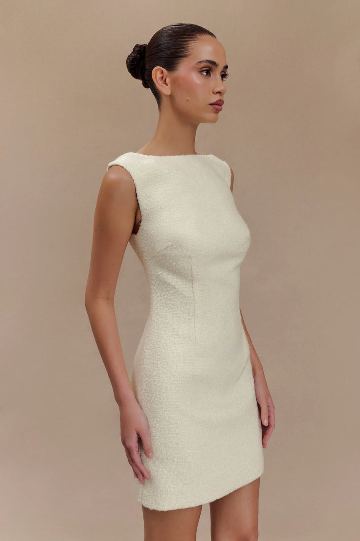 Woman wearing cream textured boucle sleeveless mini dress with white platform sandals — Meshki | Endless UAE