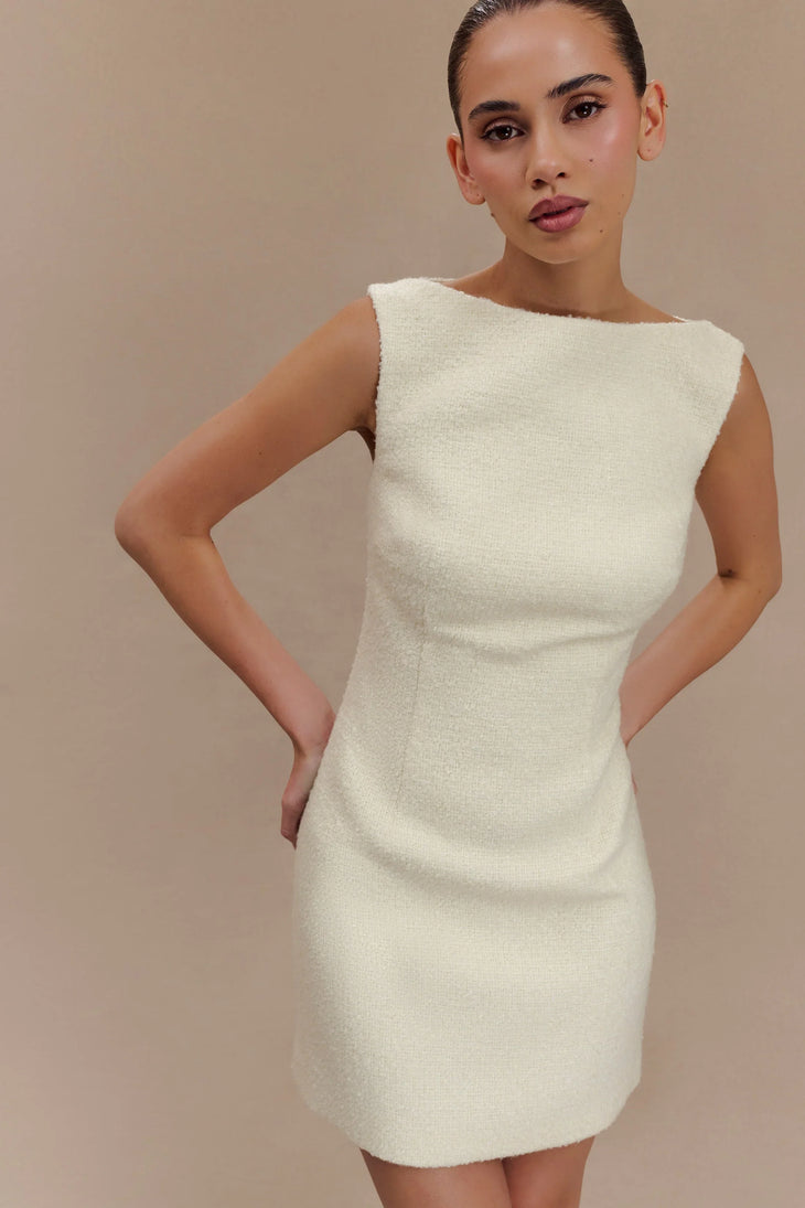 Woman wearing cream textured boucle sleeveless mini dress with white platform sandals — Meshki | Endless UAE