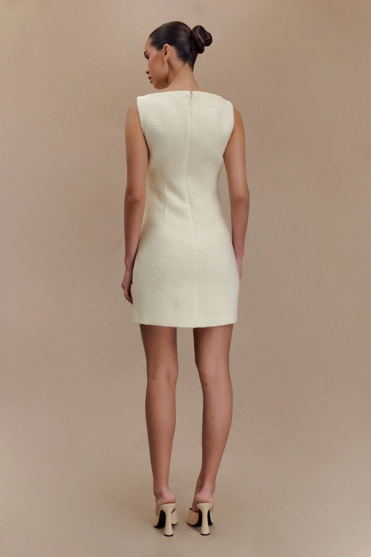 Woman wearing cream textured boucle sleeveless mini dress with white platform sandals — Meshki | Endless UAE