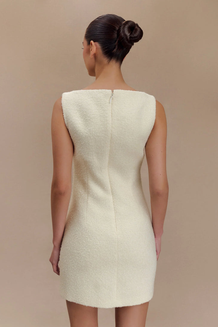 Woman wearing cream textured boucle sleeveless mini dress with white platform sandals — Meshki | Endless UAE