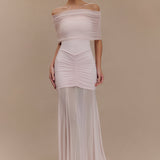Woman wearing blush off-shoulder maxi dress with ruched details and mesh panel — Meshki | Endless UAE