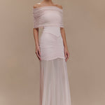 Woman wearing blush off-shoulder maxi dress with ruched details and mesh panel — Meshki | Endless UAE