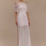 Woman wearing blush off-shoulder maxi dress with ruched details and mesh panel — Meshki | Endless UAE