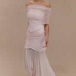 Woman wearing blush off-shoulder maxi dress with ruched details and mesh panel — Meshki | Endless UAE