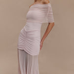 Woman wearing blush off-shoulder maxi dress with ruched details and mesh panel — Meshki | Endless UAE