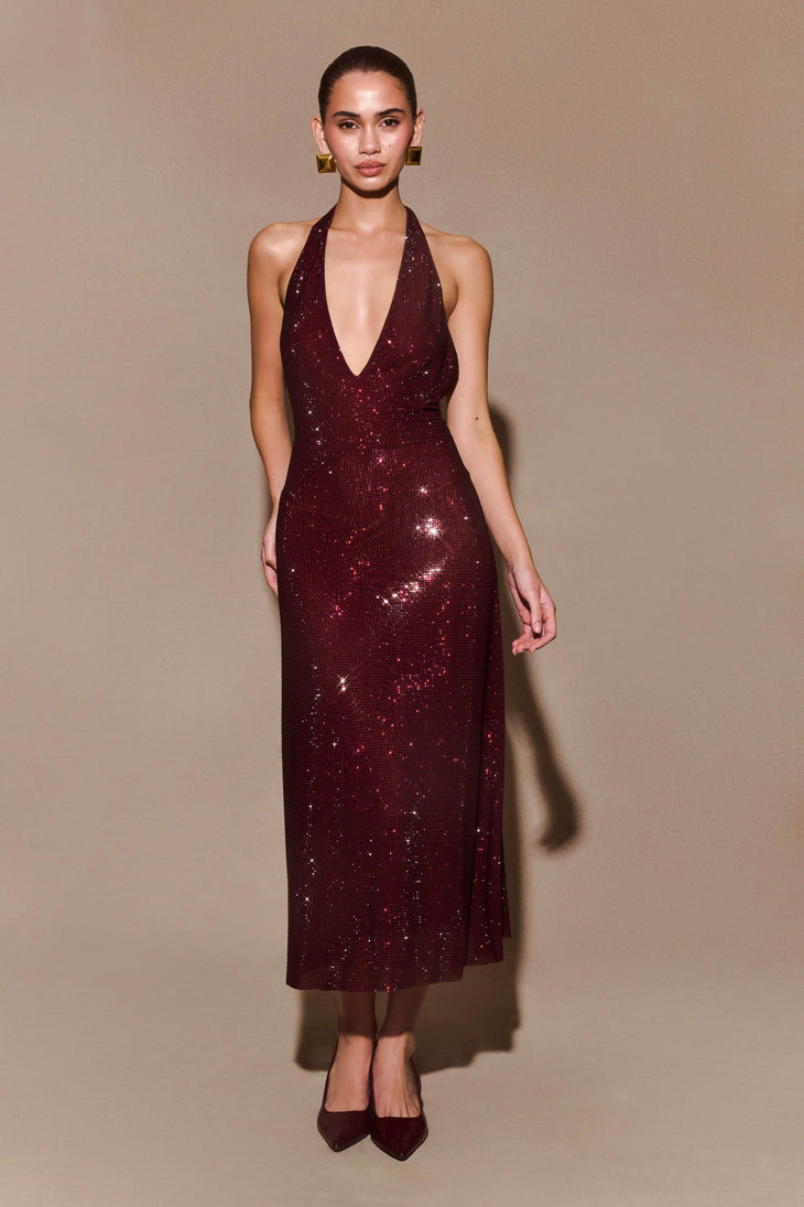 Burgundy sequined halter midi dress with plunging V-neckline and backless design paired with matching heels — Meshki | Endless UAE
