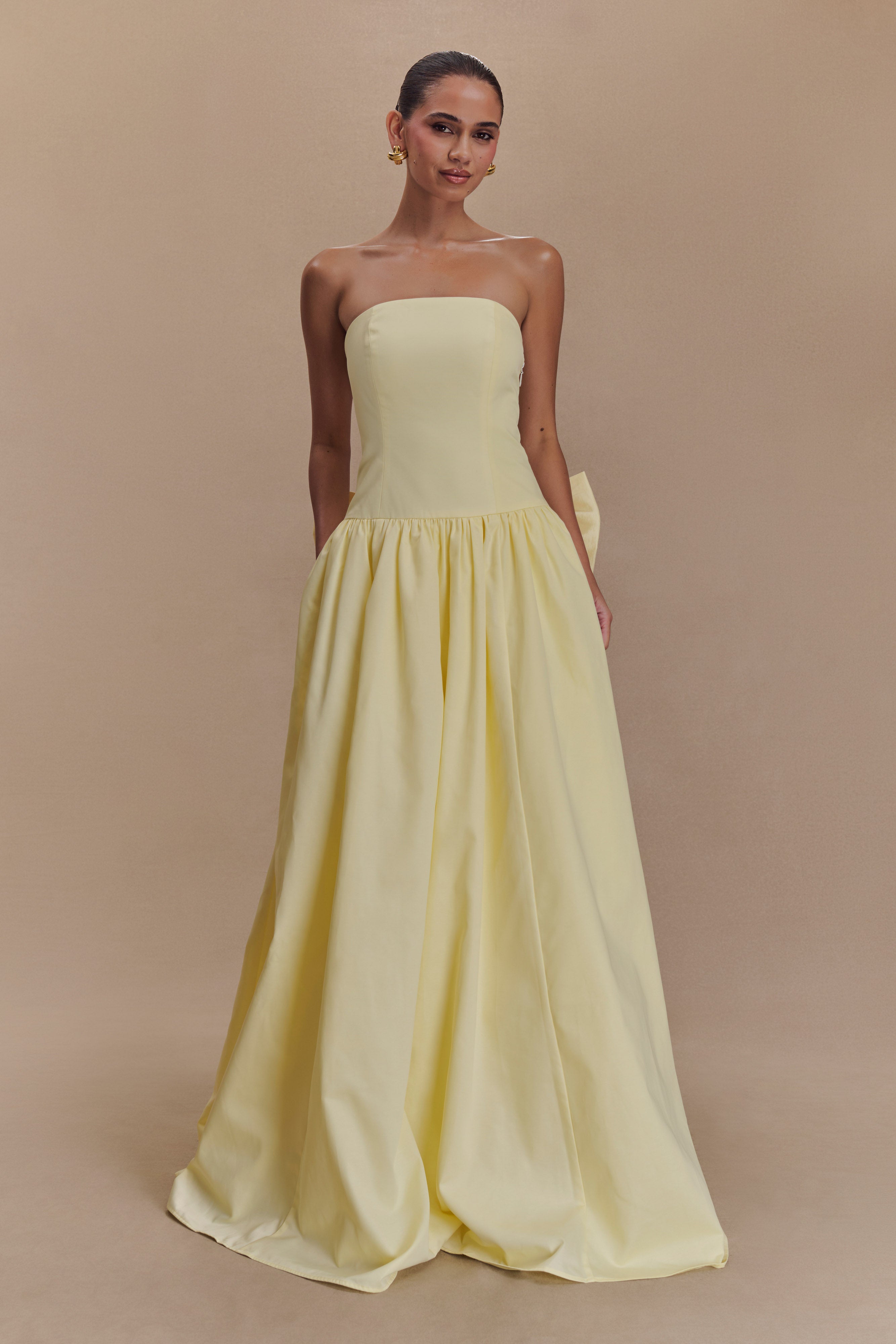 Pale yellow strapless maxi dress with fitted bodice and gathered full-length skirt — Meshki | Endless UAE