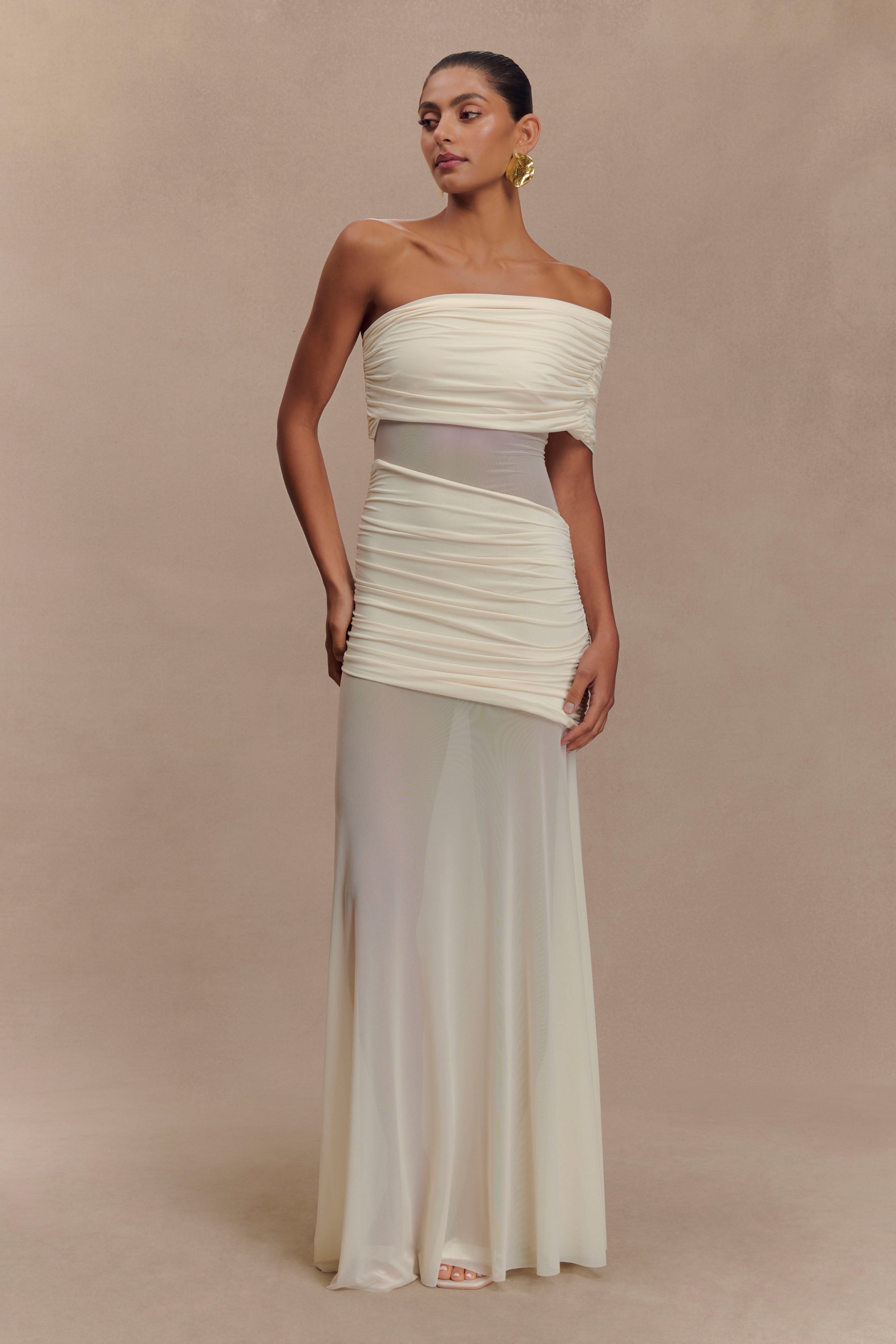 Elegant ivory one-shoulder maxi dress with ruched mesh bodice and flowing skirt — Meshki | Endless UAE