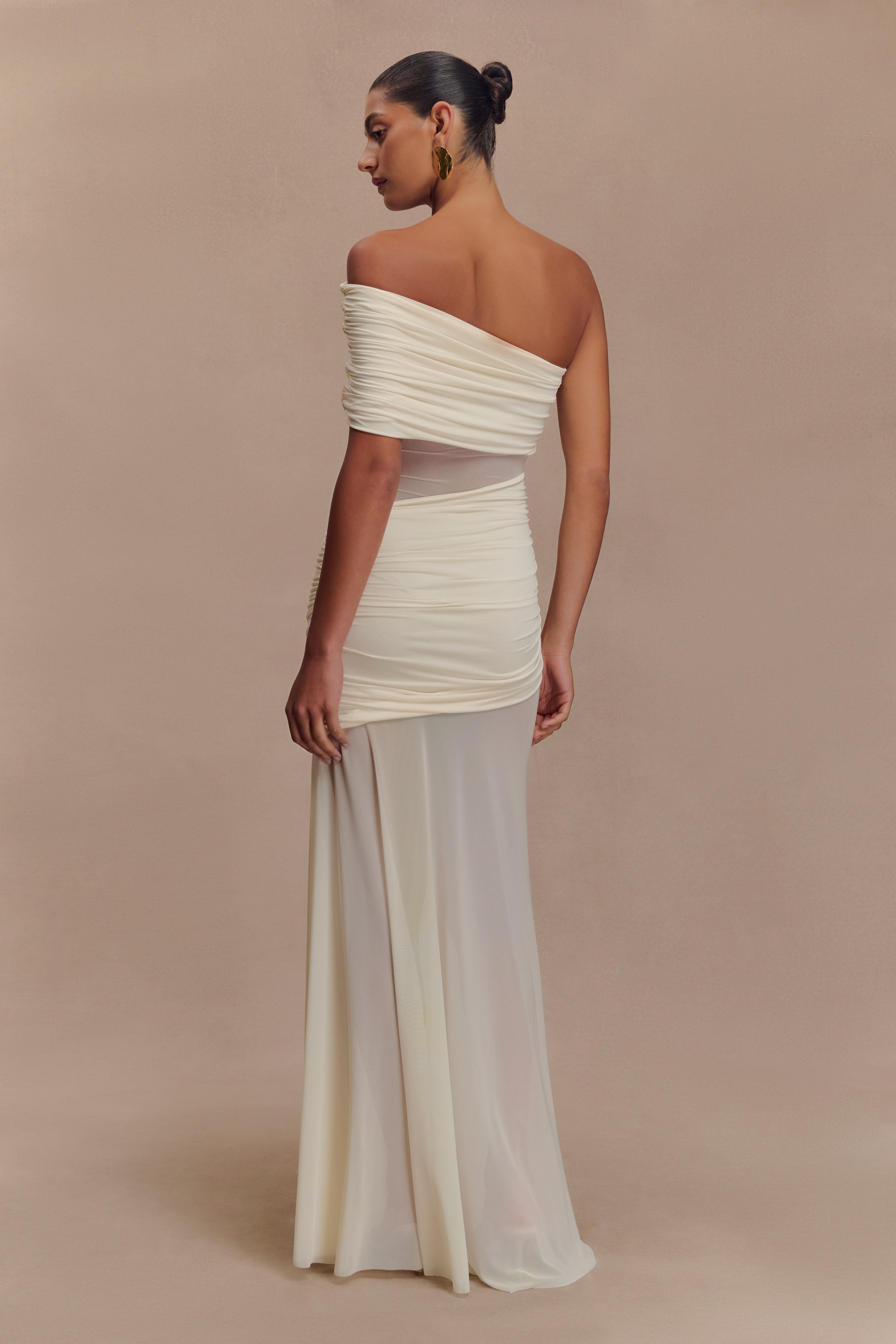 Elegant white off-shoulder maxi dress with ruched mesh bodice and flowing skirt, back view — Meshki | Endless UAE