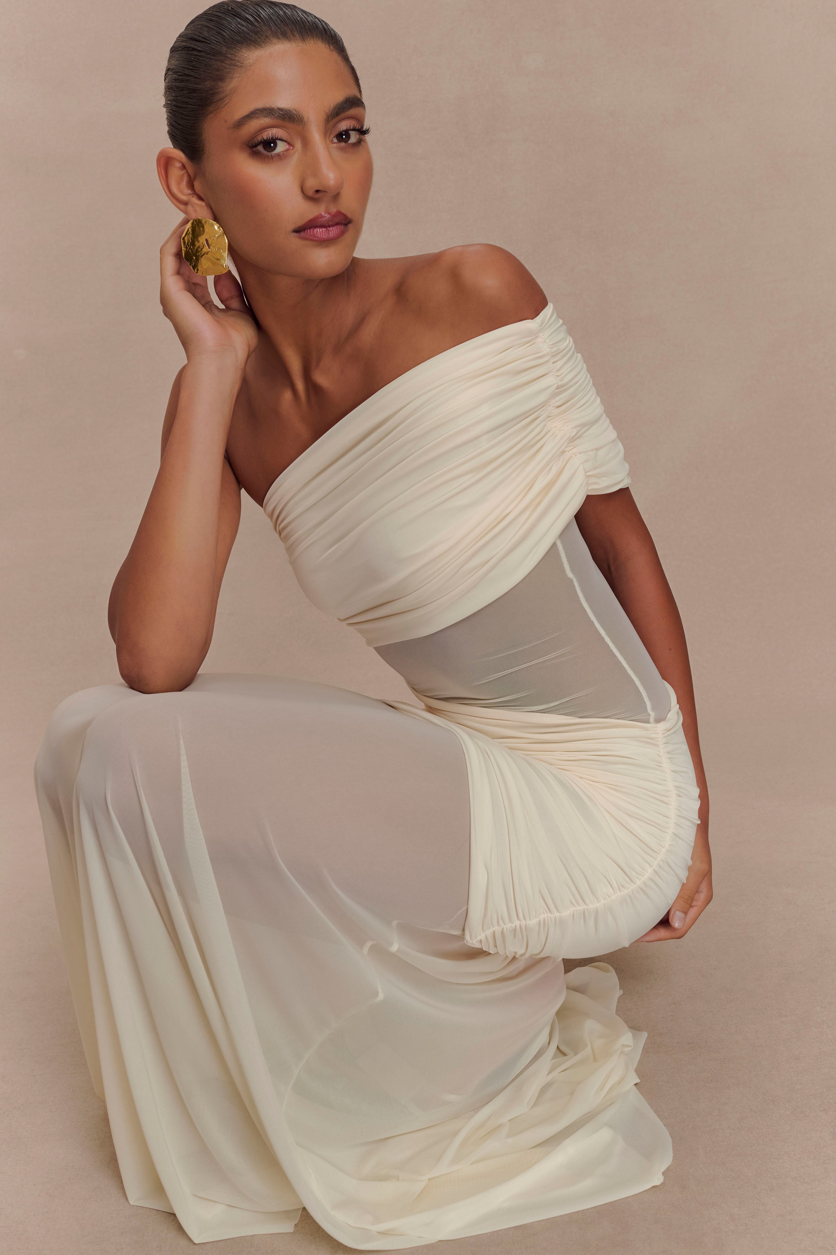 Elegant cream off-shoulder mesh maxi dress with draped detailing and flowing silhouette — Meshki | Endless UAE