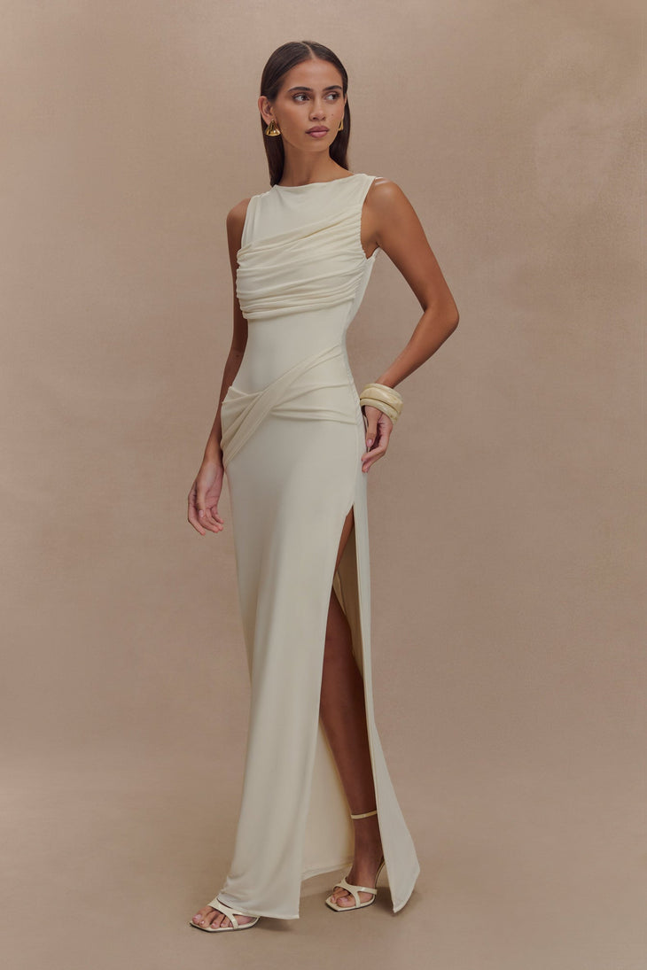 Elegant ivory sleeveless maxi dress with asymmetric draping, high slit, and form-fitting silhouette — Meshki | Endless UAE