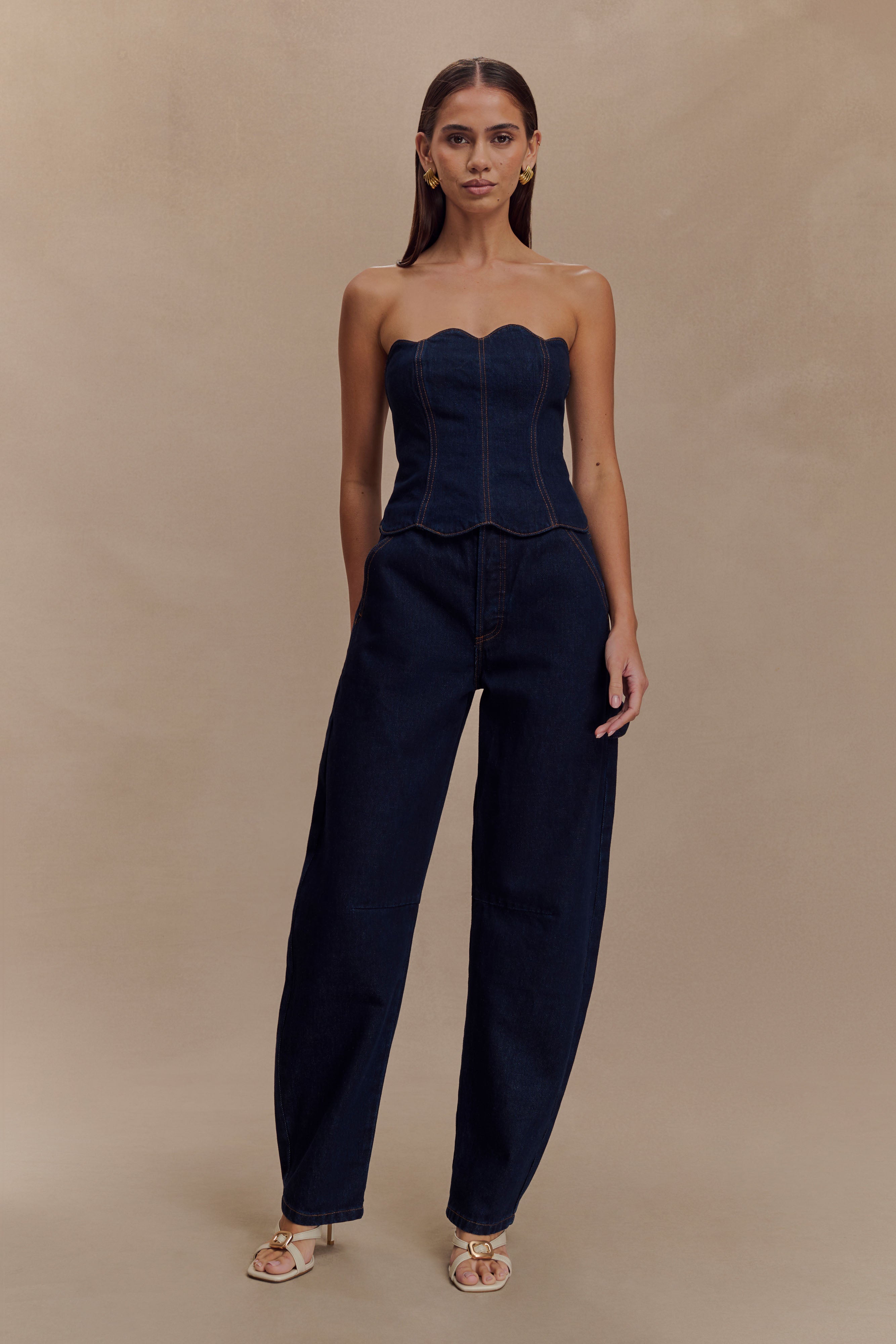 Dark indigo denim strapless corset top with scalloped neckline and exposed contrast stitching paired with matching wide-leg jeans — Meshki | Endless UAE
