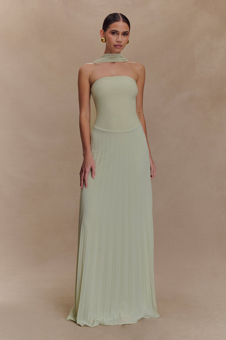 Woman wearing pale sage strapless maxi dress with pleated skirt and matching neck scarf — Meshki | Endless UAE